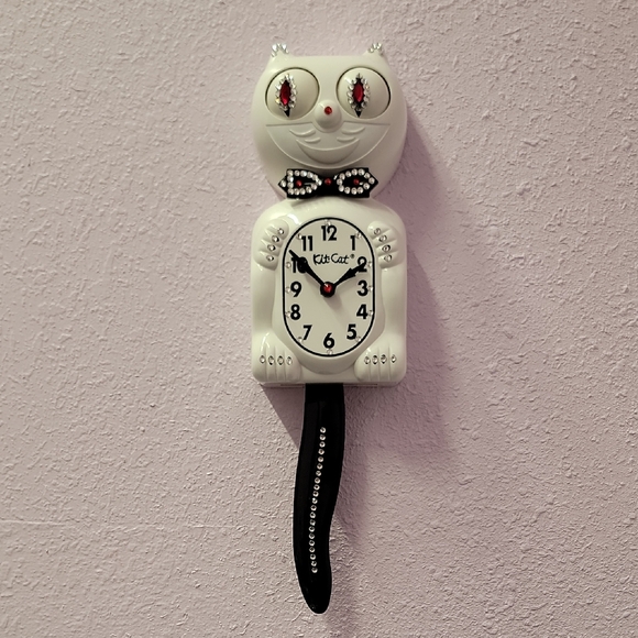 Jeweled White Kit-Cat Klock clock with black bow tie and tail